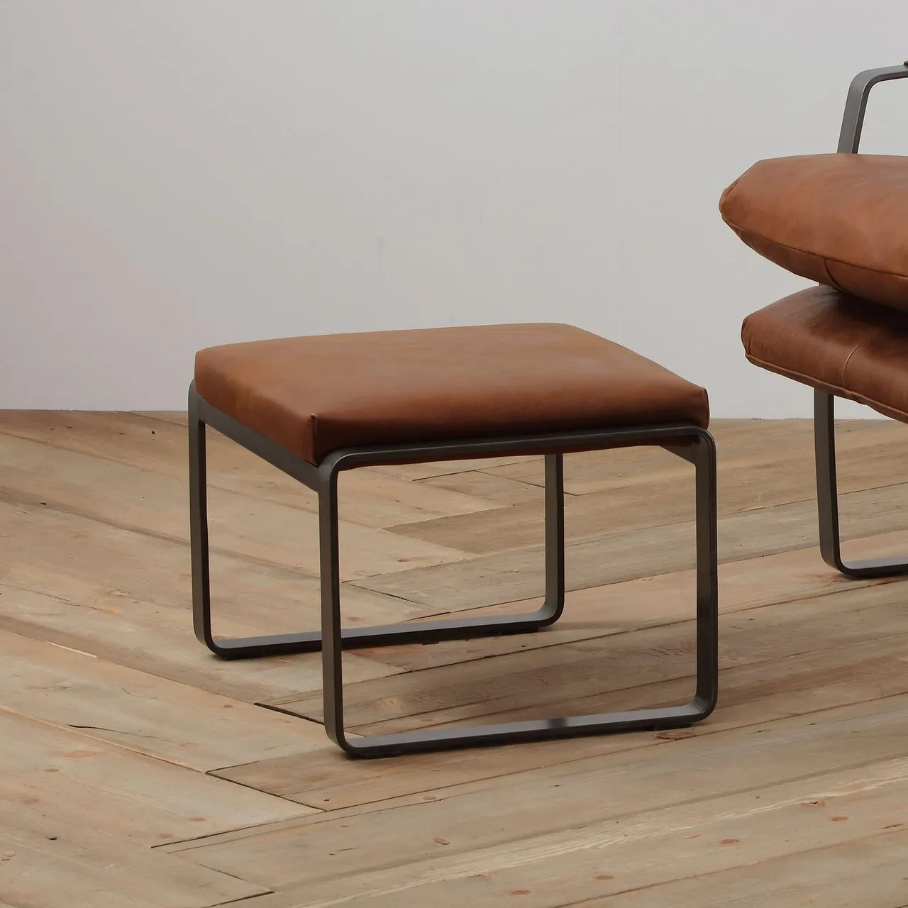 Luxora Arlow solid-wood lounge chair with hand-stitched light-brown leather upholstery