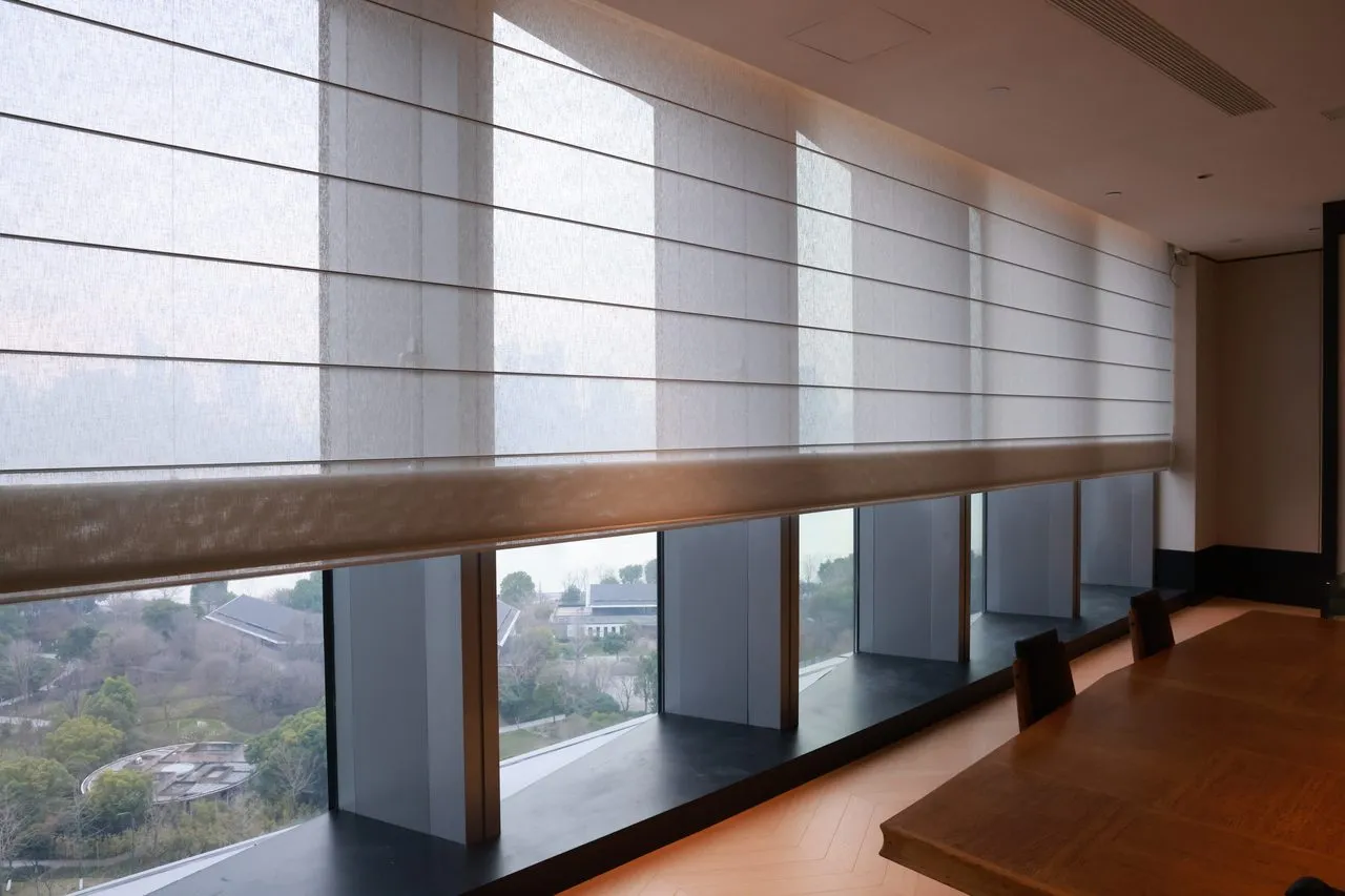 Luxora motorized roman shade in custom linen with whisper-quiet lithium-rechargeable motor