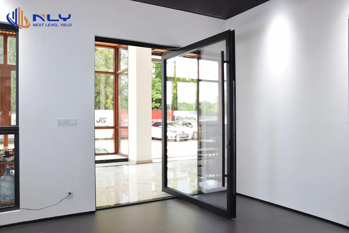 Luxora full-height glass entry door with black frame in a bright showroom interior