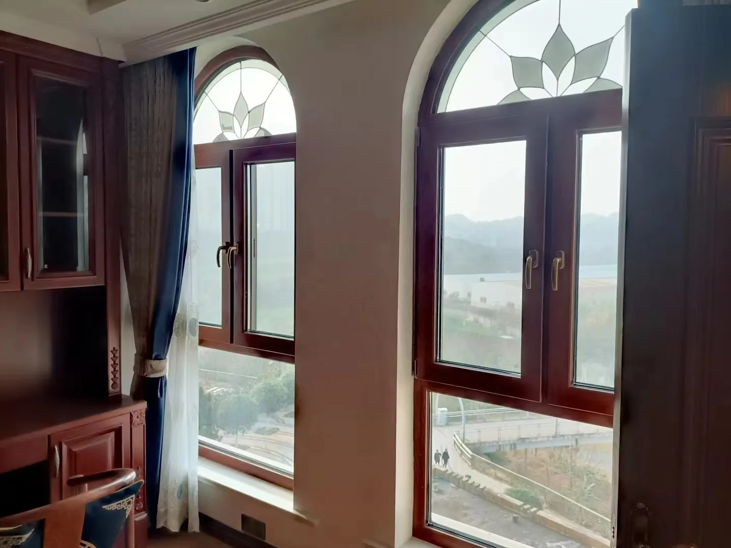 Luxora heritage timber-clad casement windows with arched transom detail
